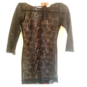 Black lace mini dress with nude slip